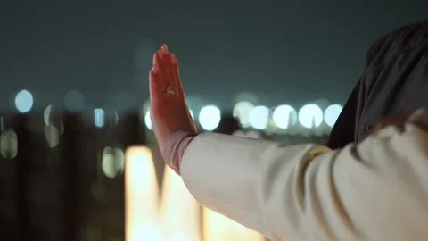 A Romantic Gesture at Night Featuring a Beautiful City Lights Background Setting Stock Footage 314576286