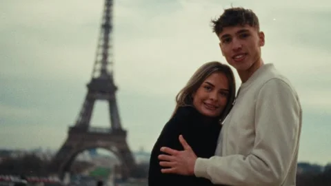 Romantic Getaway Concept Couple Embracing In Paris With Eiffel Tower Backdrop Stock Footage 330093862