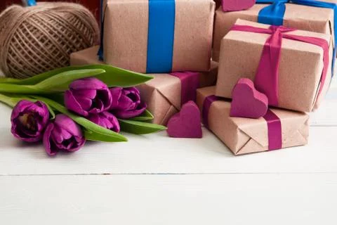 Romantic gift boxes with flowers on white wooden background Фото