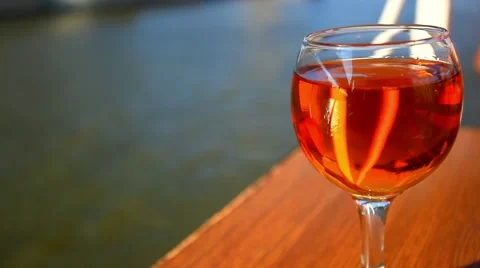 Romantic glass of wine on the table floating cruise ship at sunset. HD Stock Footage 47049465