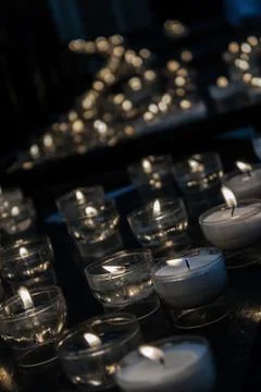 Romantic glowing long row of candlelight burning Stock Photos