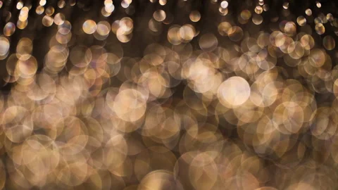Romantic gold colored bokeh background. Abstract golden light overlay. Stock Footage 146232008