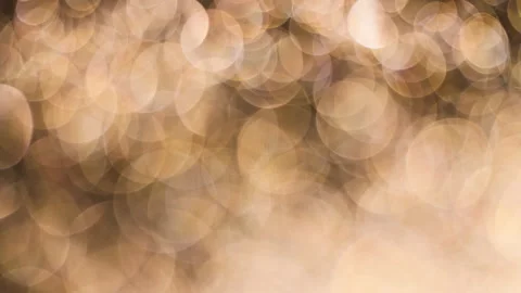 Romantic gold colored bokeh background. Abstract golden light overlay. Stock Footage 146233096