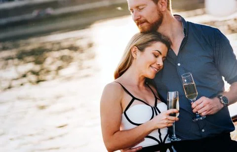 Romantic happy couples dancing and drinking at party Stock Photos