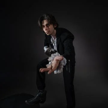The romantic hero is a duelist in a dynamic fighting stance, Stock Photos