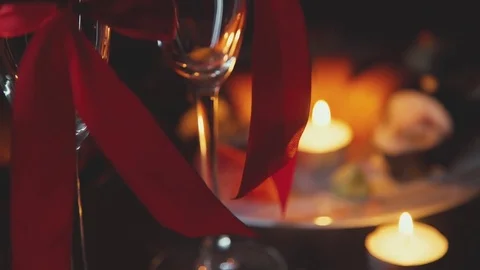 Romantic Interior: dim lights, candles, two glasses of champagne Stock Footage 71296980