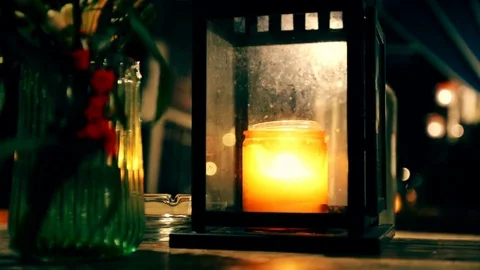 Romantic lantern light, lamp with a candle on the table Stock Footage 71295866