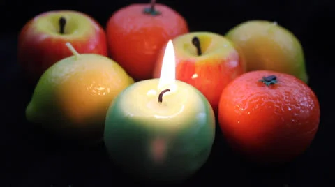 Romantic light from fruit candles Stock Footage 23654267