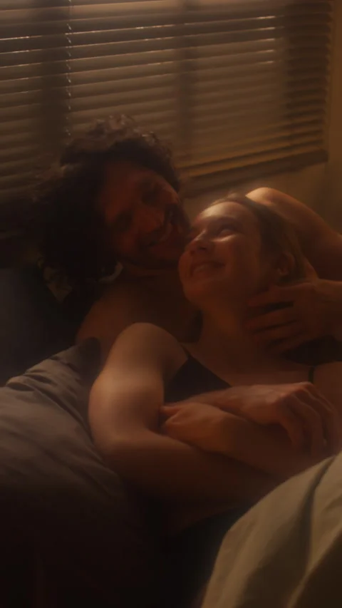 Romantic Lovers Bonding on Bed and Having Talk Stock Footage 265137558