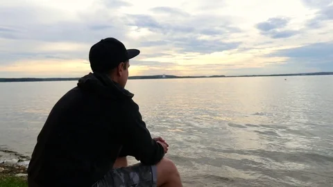 Romantic Man Enjoying Sunset at the Beach. Stock Footage