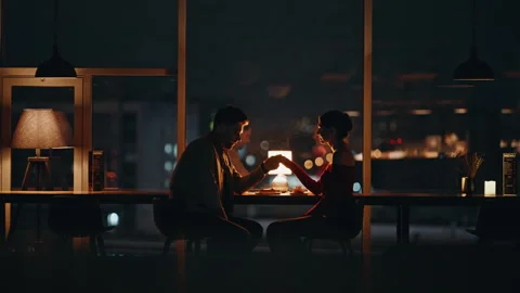 Romantic man holding hand beloved woman at night date in luxury restaurant. Stock Footage 340110852