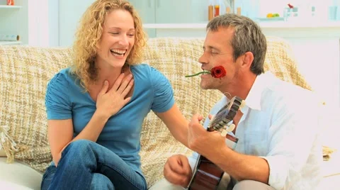 Romantic man playing guitar Stock Footage 2025860
