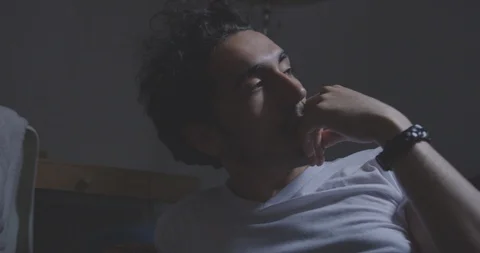 Romantic Man Relaxes Thoughtfully On Couch Stock Footage 94413137