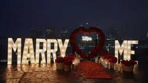 A Romantic Marriage Proposal Setup with a Beautiful City Skyline in the Stock Footage 316512251