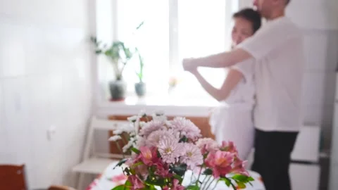 Romantic married couple dancing at home near the window against a background of Stock Footage 277458157