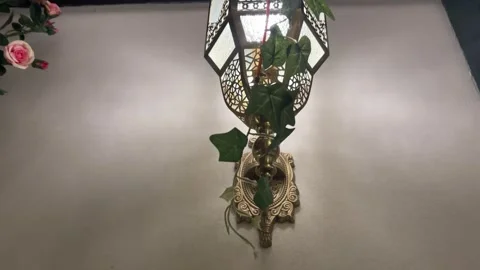 Romantic Middle Eastern Wall Lamp with Pink Roses in Dim Light Vídeos de archivo 333130862