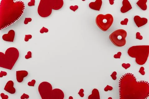 Romantic mockup. Frame made of different size red hearts on white background Stock Photos