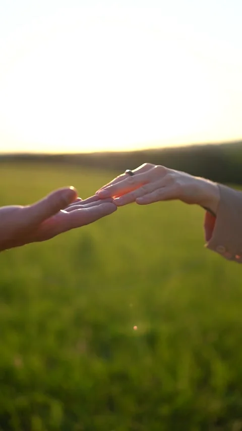 A Romantic Moment: Hands Reaching at Sunset Stock Footage 280302145