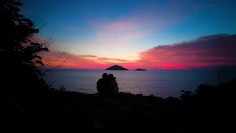 Romantic motion lapse of the couple during spectacular sunset Stock Footage 157956895