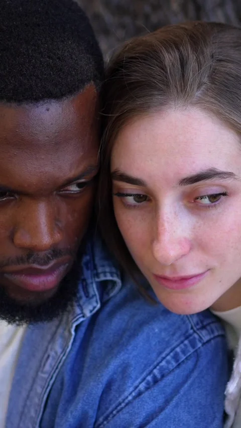 Romantic multiracial couple looking at each other in a park Stock Footage 291516479