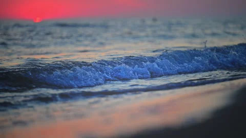 Romantic ocean sunset with soft waves on sandy shore, beautiful 4K footage. Stock Footage 335308700