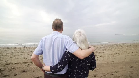 Romantic old couple beach view Stock Footage 89693616