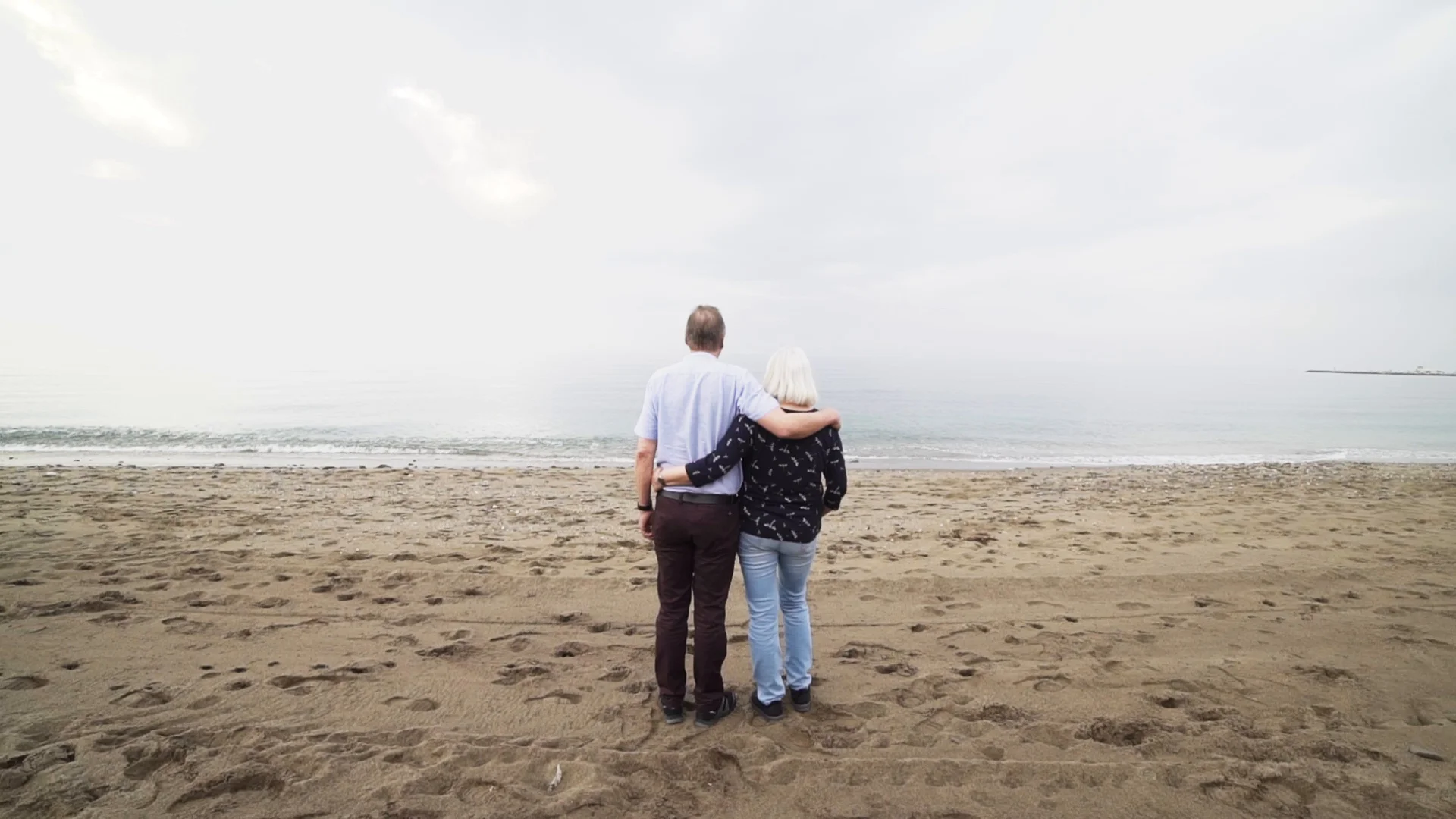 romantic old couple beach view wide