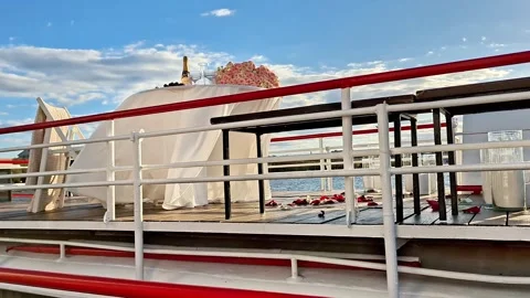 Romantic Outdoor Dining Table with Flowers on a Small Boat 動画素材 335436134