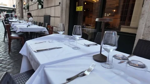 Romantic outdoor table setting at a traditional Italian restaurant Stock Footage 339780814