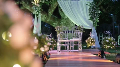 Romantic outdoor wedding ceremony setup with decorated aisle, floral 스톡 동영상 332621354