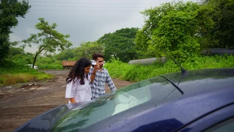 Romantic pair enjoys a vacation outing in lush plants Stock Footage 311147099