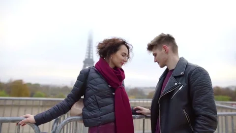 Romantic pair of lovers is hugging in Paris in autumn day, woman is flirting Stock Footage 98808745
