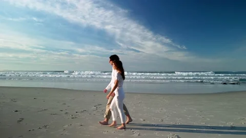 Romantic Pair Strolling On Seashore At Sunset Stock Footage 227520528