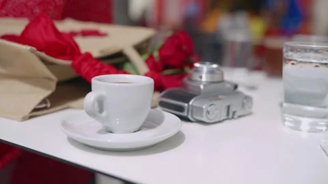 Romantic Paris Cafe Table: Coffee, Camera &amp; Couple Moment Stock Footage 332484471