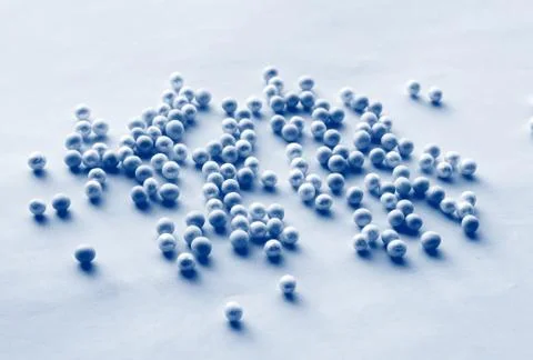 Romantic pattern of blue and blue beads scattered on a soft blue background,  Stock Photos