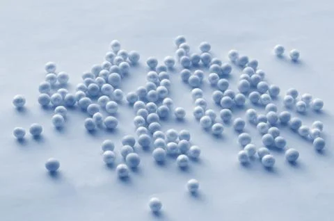 Romantic pattern of blue and blue beads scattered on a soft blue background,  Stock Photos