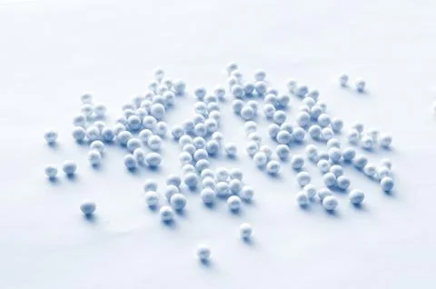 Romantic pattern of blue and blue beads scattered on a soft blue background,  Stock Photos