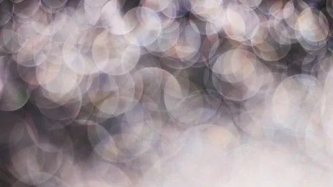 Romantic pearl or silver colored bokeh background. Abstract light overlay. Stock Footage 146232393