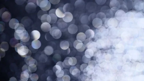 Romantic pearl or silver colored bokeh background. Abstract light overlay. Stock Footage 146234109