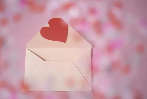 Romantic pink background with an open envelope Stock Photos
