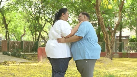 Romantic plus size obese indian couple dancing outdoor. Overweight husband .. Stock Footage 312847954