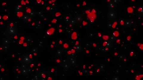 Romantic red heart shaped confetti falling gently against a dark background Stock Footage 339257403