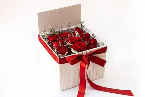 Romantic red roses in a square white gift box. on white background Stock Photos