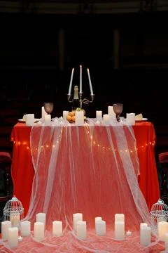 Romantic Red Table Setting with Candles and Champagne for Valentine's Day D.. Stock Photos