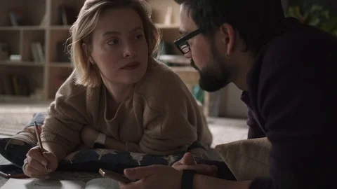 Romantic relationship between colleagues. She looks at the man in love Stock Footage 123079978