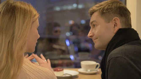 Romantic relationship. A young couple is in a cafe. Video stock 82923786