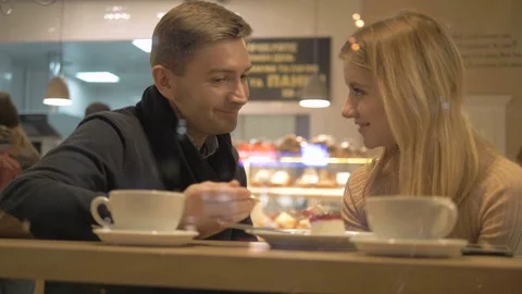 Romantic relationship. A young couple is in a cafe. Stock Footage 82924073