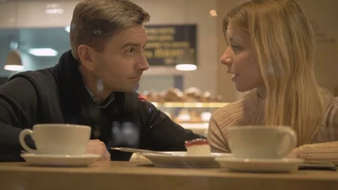 Romantic relationship. A young couple is in a cafe. Stock Footage 82924166