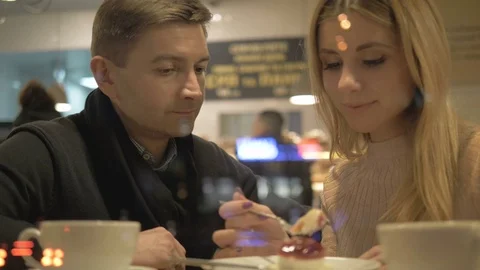 Romantic relationship. A young couple is in a cafe. Stock Footage 82924480