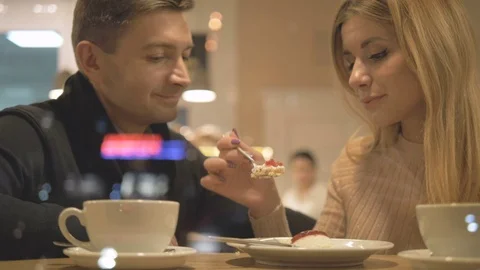 Romantic relationship. A young couple is in a cafe. Stock Footage 82924635